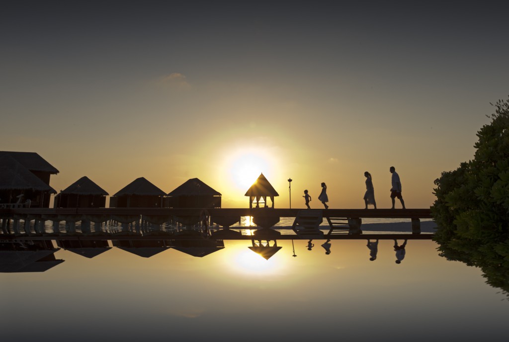 Family on the boardwalk at Dhigu Spa