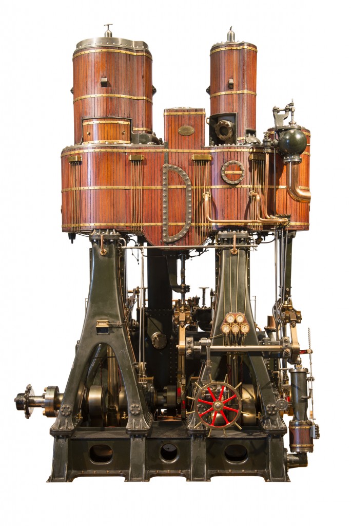 T.1962.10 TECHNOLOGY steam engine model Carlaw, David (maker); Brock, Walter (designer) Scotland, Glasgow, Leven Shipyard, Wm Denny Bros (place of manufacture) 1887 wood; metal; brass overall: 980 mm x 850 mm x 610 mm Steam engine model in glazed case with electric drive. Vertical cylinders encased in timber with brass strips. Cast iron frame in dark grey with full auxiliaries in fine detail. Made by David Carlaw. Model of quadruple expansion tandem engine fitted in the SS Buenos Aires, 1887.